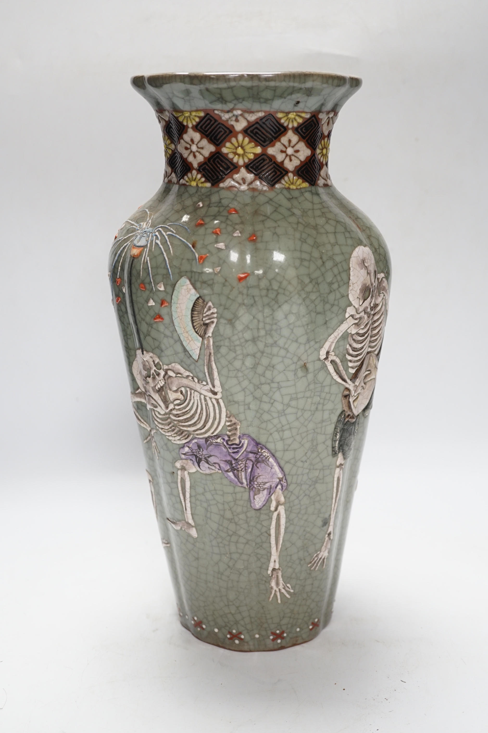 A Japanese crackleware pottery vase decorated with skeletons, 35cm high